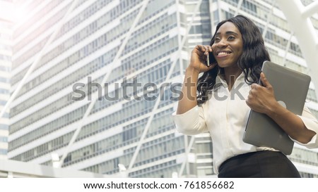 Portrait business african woman uses smart mobile phone