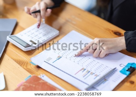 Portrait of business asian woman Accounting using calculating income-expenditure and analyzing real estate investment data report Financial and tax systems concept.	 ストックフォト © 
