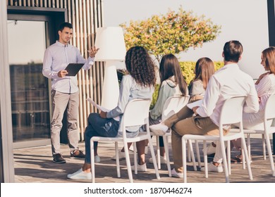 Portrait Of Business Colleagues Sitting Chairs Listen To Speaker Talking Show Hand Hold Clipboard Outdoors