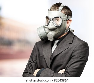 Portrait Of Business Man With Gas Mask Against At Outdoor