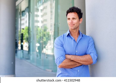 Portrait Of A Business Man Standing Outside With Arms Crossed