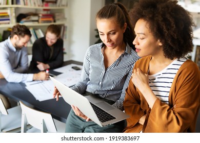 Portrait of business people, architects having discussion in office - Powered by Shutterstock