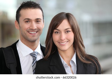 Portrait Of Business People Standing Outside The Airport