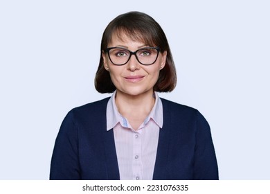 Portrait of business smiling woman looking at camera, white background - Shutterstock ID 2231076335