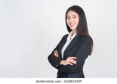 portrait of a business woman , beautiful Asian girl whit suit standing arms crossed isolated on white background , business people concept