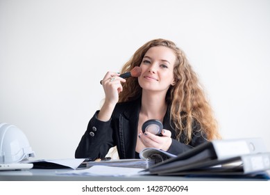 Portrait Of Business Woman Doing Make Up At Her Office During Work