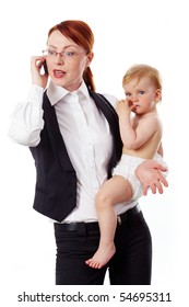 Portrait Of Business Woman Holding Her Small Daughter While Speaking On The Phone