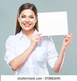 Portrait Of Business Woman Holding Up Sign Board. Isolated Studio Background. Smiling Model With Long Hair. Business Person.