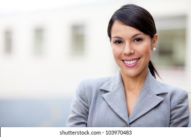 Portrait Of A Business Woman Looking Happy And Smiling