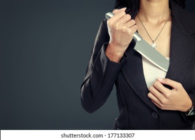 Portrait Of Business Woman Pull Out Her Knife. Ready To Attack