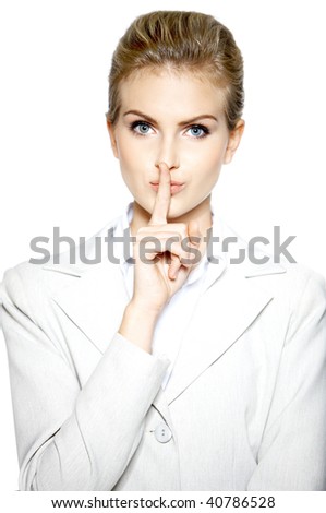 Portrait of a business woman with silence sign isolated on white background
