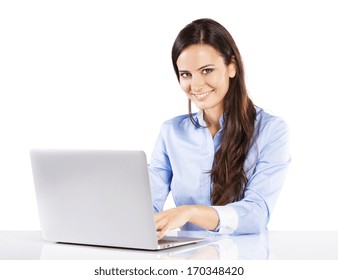 Portrait Of Business Woman Sitting On Her Desk Working With Laptop Isolated Over White Background.