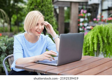 Portrait Business Woman Talking On Smartphone Use Notebook Laptop At Coffee Cafe Outdoors. Beautiful Girl At Desk Computer Online Business Call. Startup Business Woman