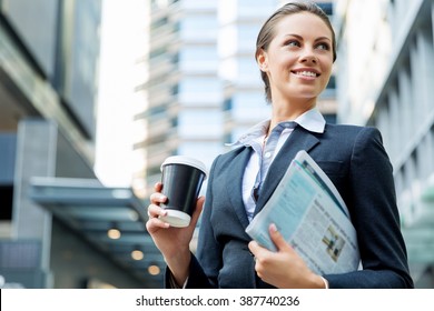 Portrait Of Business Woman Walking And Smiling Outdoor