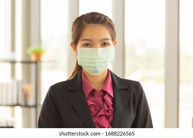 Portrait Of Business Woman Wearing Medical Mask Or Face Mask For Protect Coronavirus Covid - 19