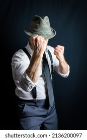 Portrait Of Businessman In White Dress Shirt And Old Fedora Hat With Fists Raised Ready To Fight. Vintage Style And Retro Fashion Of Film Noir Detective Or Crime Fighter.