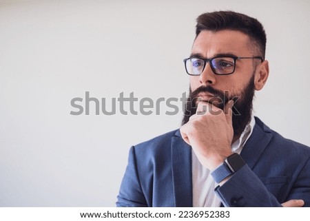 Portrait of businessman who is thoughtful and worried. Copy space on image for your text or advert.
