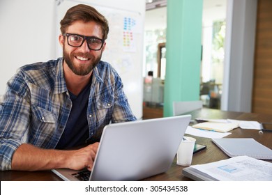 Portrait Of Businessman Working In Creative Office - Shutterstock ID 305434538