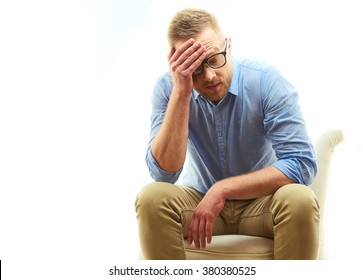 Portrait of businessmen with facial expression of Stress disappointed or sad with hand on the head, glasses in modern blue shirt isolated on white background