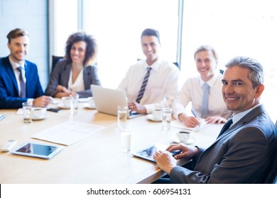 Portrait of businesspeople in conference room during a meeting - Shutterstock ID 606954131