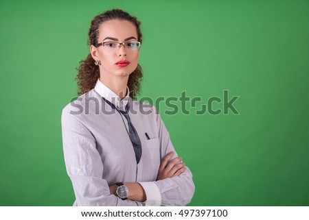 portrait of a businesswoman or a consultant on a green background
