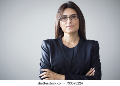 Portrait of businesswoman on grey background