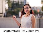 Portrait of a businesswoman on the street of a city.