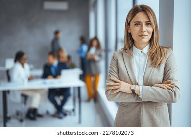 Portrait of a businesswoman standing in a a modern office. Portrait of beautyful and confident business woman. I've solidified my name in the business world. Portrait of middle aged businesswoman  - Shutterstock ID 2278102073