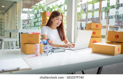 Portrait of Businesswoman working on laptop for financial data at workplace.Shopping Online, SME concept. - Powered by Shutterstock