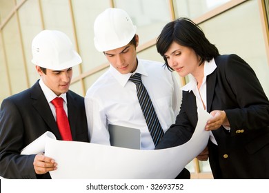 Portrait Of Busy People Planning Their Work Together Outside At Summer