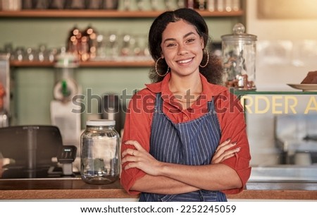 Portrait, cafe waiter and woman with arms crossed ready to take your order. Coffee shop, barista and confident, happy and proud young female employee from Brazil or small business owner of cafeteria.
