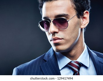 Portrait Of Calm Man In Sunglasses Posing For Camera