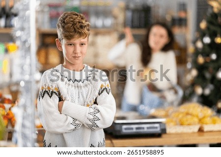 Portrait of capricious, offended boy whose mother forbade him to buy candy in the store