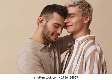 Portrait Of Carefree Gay Couple In Studio