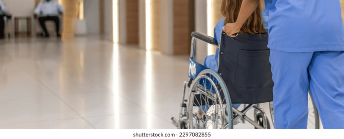 Portrait of caring nurse woman service help support discussing and consulting care with sick patien sitting in wheelchair at hospital corridor, caregiver, recovery.healthcare and insurance - Powered by Shutterstock