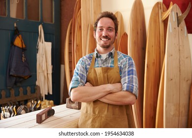 Portrait Of Carpenter Making Bespoke Surfboards In Workshop - Powered by Shutterstock