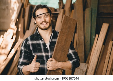 Portrait Of Carpenter Young SME Furniture Shop Owner Smiling In Wood Workshop Look Professional Skilled Real People Handcraft Workman.