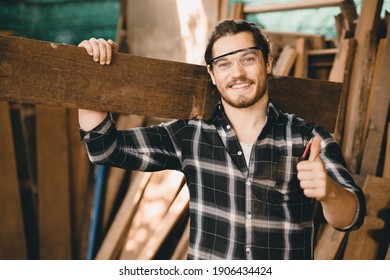 Portrait Of Carpenter Young SME Furniture Shop Owner Smiling In Wood Workshop Look Professional Skilled Real People Handcraft Workman.