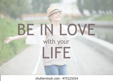 Portrait of casual traveler girl in straw hat feeling ecstatic and alive on the street. Young joyful lady breathing fresh air with closed eyes outdoors. Motivational phrase "Be in love with your life"