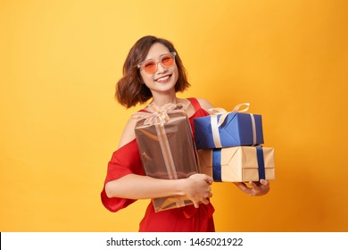 Portrait Of Casual Young Happy Smiling Woman Hold Gift Box. 