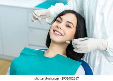 Portrait of Caucasian beautiful girl patient smiling and waiting for   treatment from professional dentist for oral care check up about cavities and gum disease in tooth care program of dental clinic.