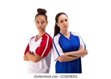 Portrait Of Caucasian And Biracial Young Female Soccer Players Standing With Arms Crossed. White Background, Unaltered, Sport, Sports Uniform, Competition, Rivalry And Women's Soccer.