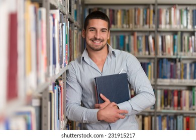 A Portrait Of An Caucasian College Student Man In Library - Shallow Depth Of Field