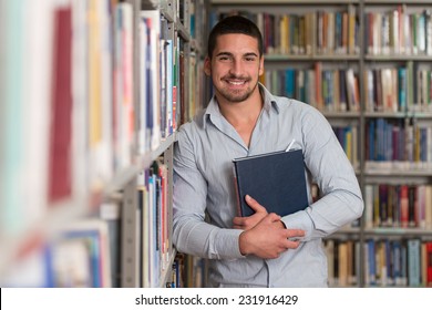 A Portrait Of An Caucasian College Student Man In Library - Shallow Depth Of Field