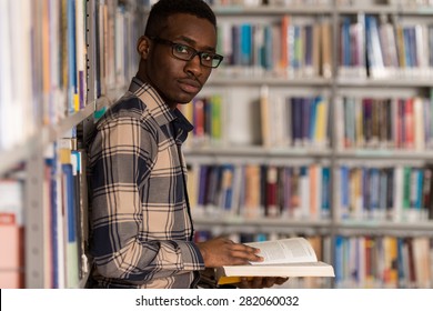 A Portrait Of An Caucasian College Student Man In Library - Shallow Depth Of Field