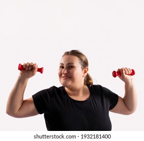 Portrait Of Caucasian Fat, Overweight, Obese Woman, Looking To Camera With Smile, Exercises With Red Dumbells For Fit Healthy, Gray Background.