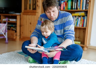 Portrait Of Caucasian Father Hold Story Book Reading With Daughter Little Girl. Home School Learn From Teacher, Education Happy Family Love Together, Bed Time Story Fathers Day Concept