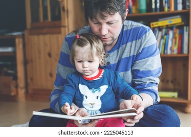 Portrait Of Caucasian Father Hold Story Book Reading With Daughter Little Girl. Home School Learn From Teacher, Education Happy Family Love Together, Bed Time Story Fathers Day Concept