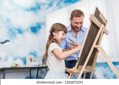 Portrait caucasian father teach  daughter little artist girl to paint   draw picture art class  Home school learn from art teacher  education activities family love daddy father’s day concept 