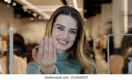 Portrait Caucasian Female Shopper Seductive Smiling Woman Saleswoman Owner Of Clothing Store Looking At Camera Making Gesture Hey You Come Here Inviting Waving Hand Offer Discount Tempting Approaching